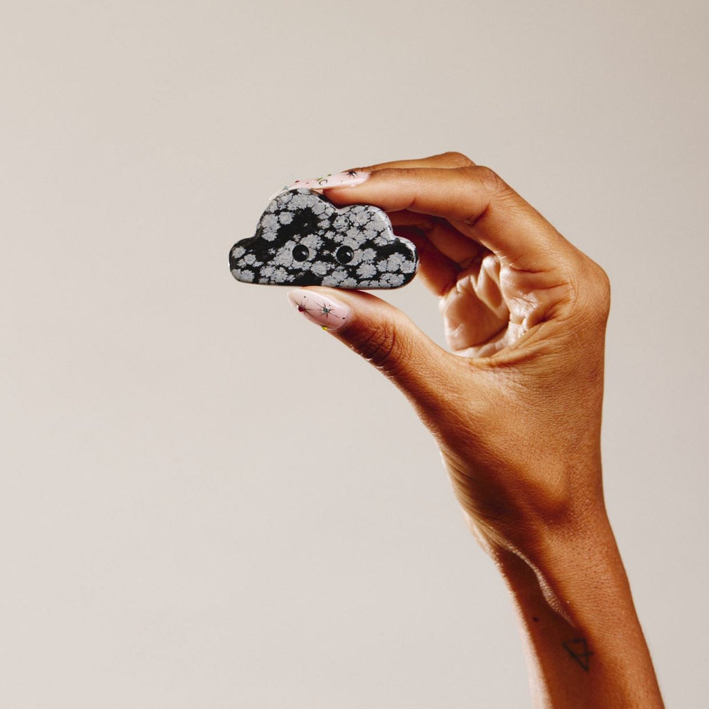 Hand holding crystal cloud