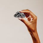 Hand holding crystal cloud
