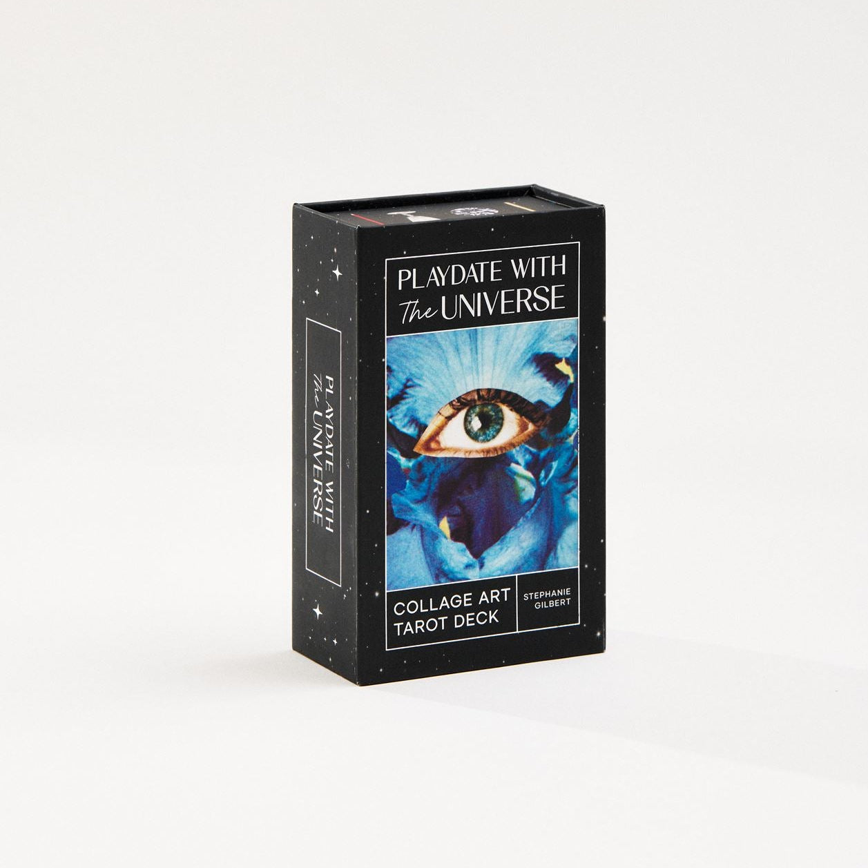 tarot deck box with Playdate with the Universe title, Collage Art Tarot Deck subtitle, Stephanie Gilbert as the author. Card art featured on box with blue iris flower and blue eye collaged in the center