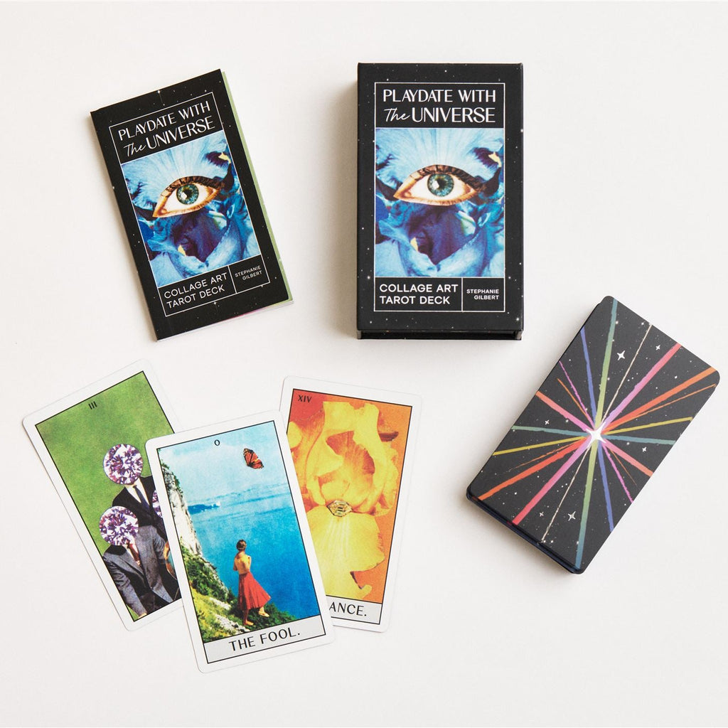 Tarot deck box, guidebook and deck laid on a white surface