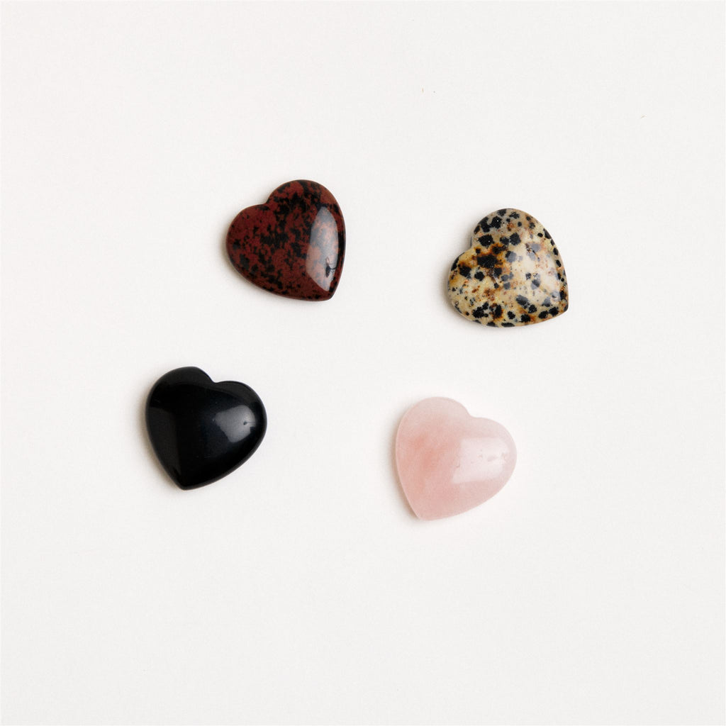 heart shaped crystal assortment on white surface