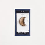 smokey quartz moon crystal on white surface