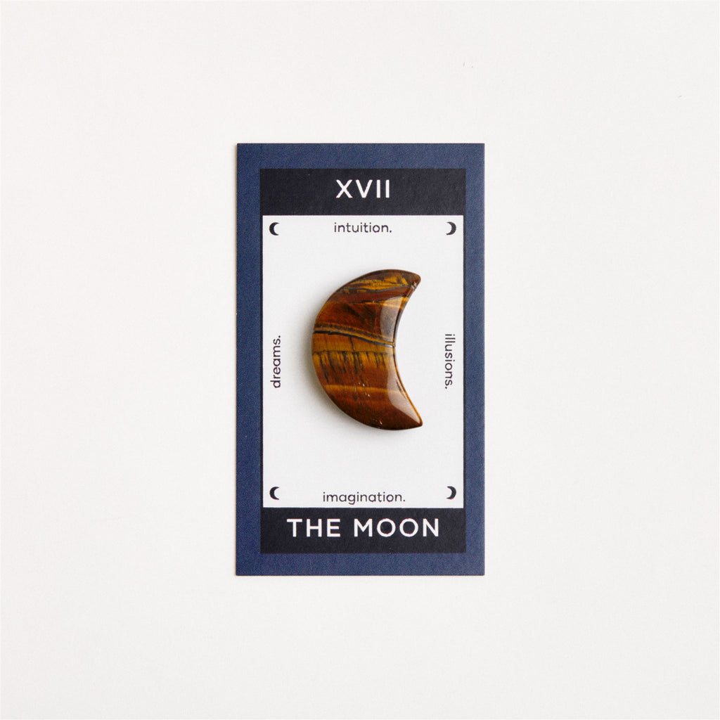 tiger eye moon on white surface
