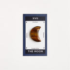 tiger eye moon on white surface