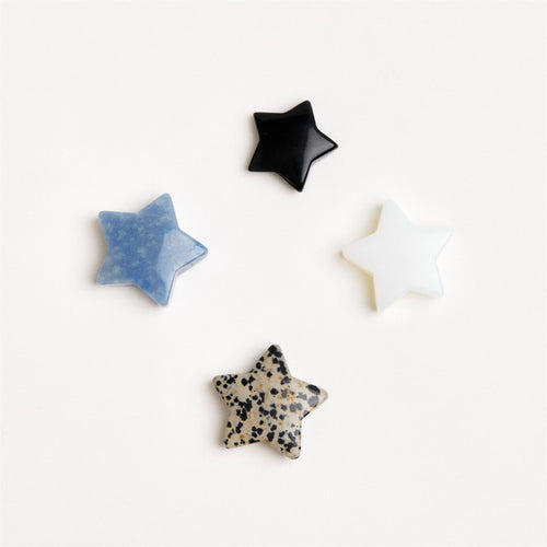 assorted star shaped crystals on white background